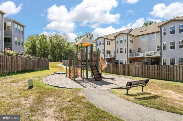a view of a park with iron fence