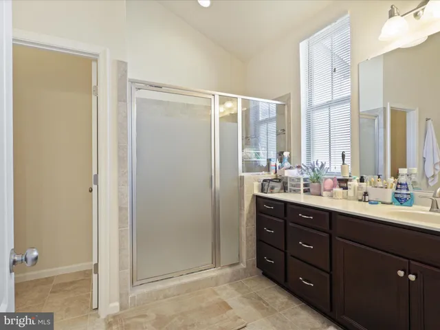 a bathroom with a double vanity sink mirror and double