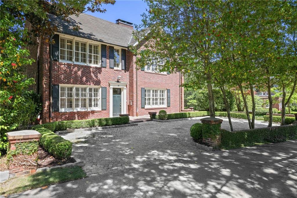 10 Palisades Road Northeast Atlanta, GA 30309 - Photo 1 of 49 a view of a front view of a house with a garden