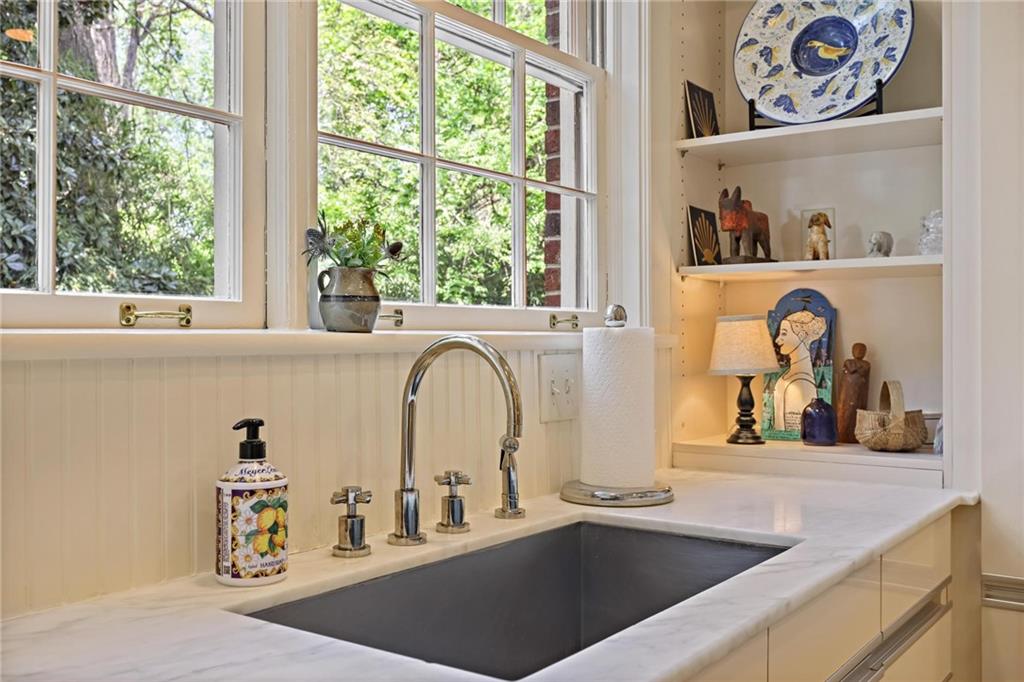 10 Palisades Road Northeast Atlanta, GA 30309 - Photo 15 of 49 a kitchen with sink a window and a potted plant