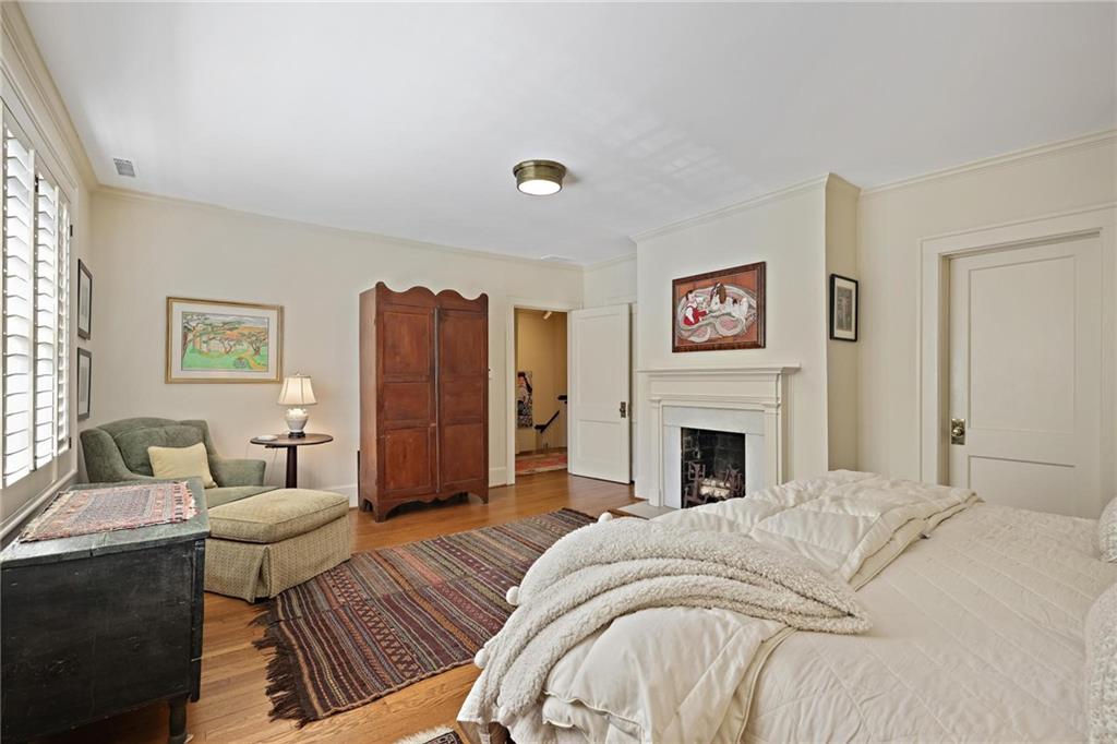 10 Palisades Road Northeast Atlanta, GA 30309 - Photo 23 of 49 a living room with furniture and a fireplace