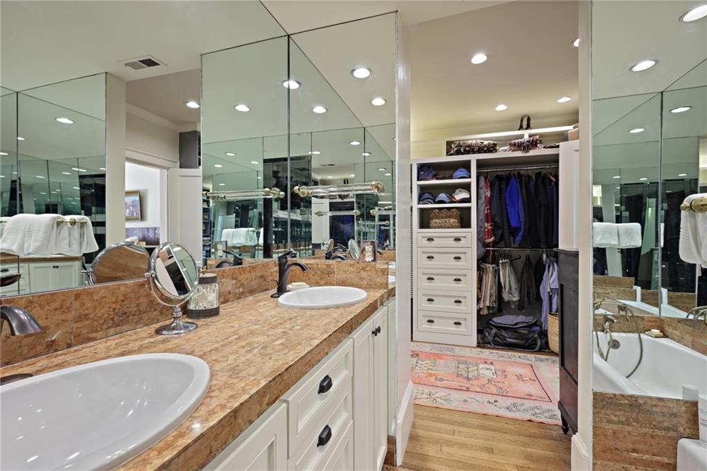 10 Palisades Road Northeast Atlanta, GA 30309 - Photo 27 of 49 a bathroom with a granite countertop sink and a large mirror