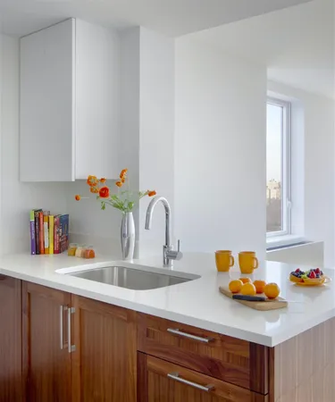a kitchen with a sink cabinets and appliances