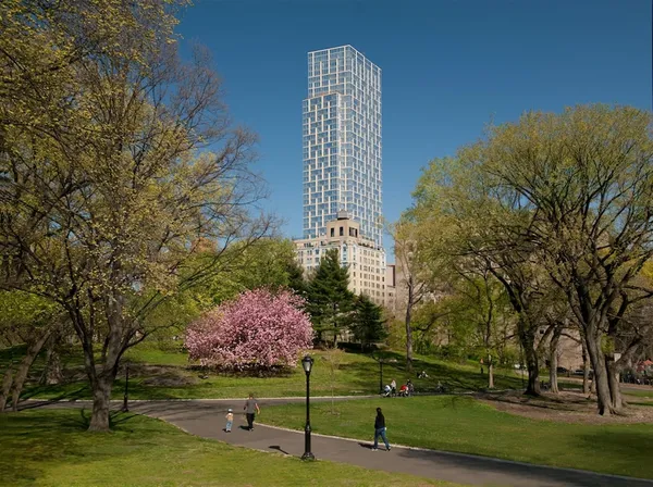 a room with lots of furniture and paintings on the wall