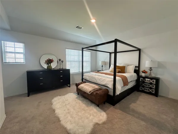 a bedroom with a bed and a closet
