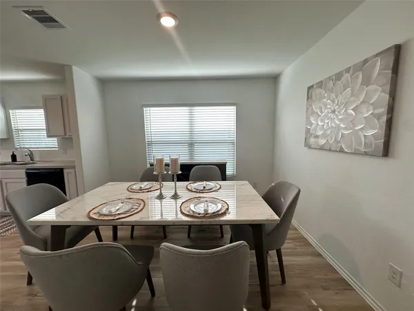 a view of a dining room with furniture