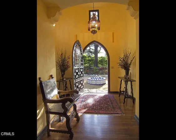 a view of swimming pool with a table and chairs in patio