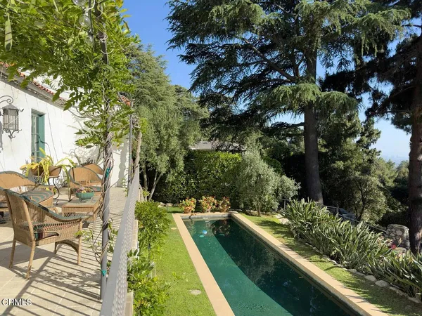 a view of swimming pool with chairs