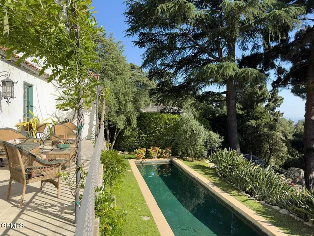 a view of swimming pool with chairs