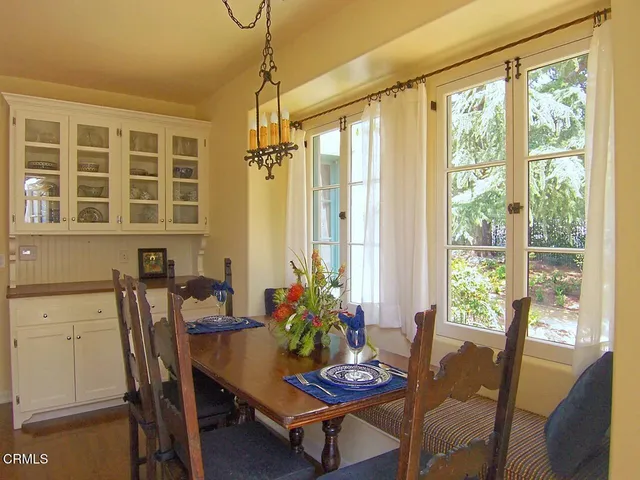 a dining room with furniture and window