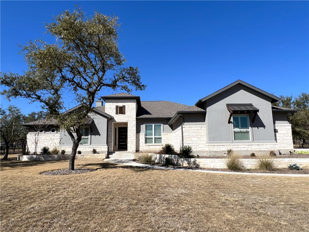 a front view of a house with a snow