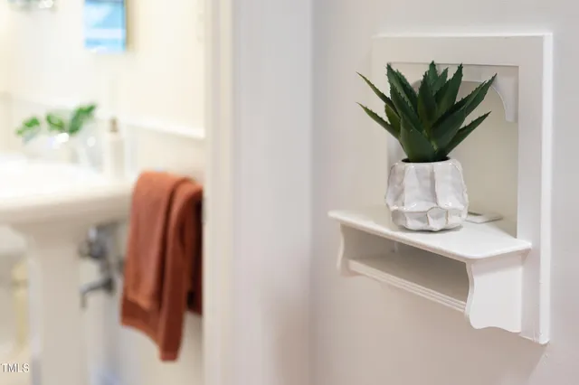 a bathroom with a toilet and a shower curtain