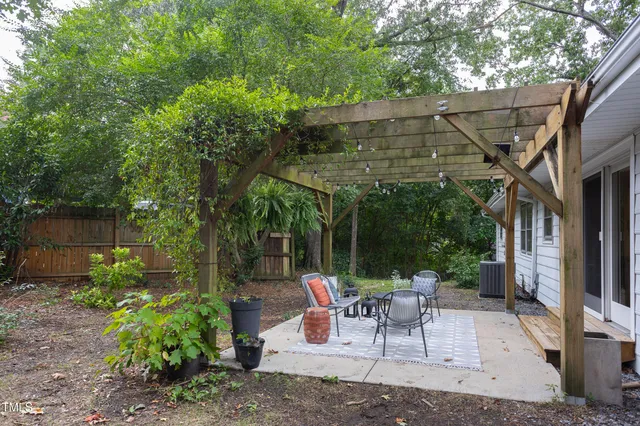 a view of a garden filled with potted plants
