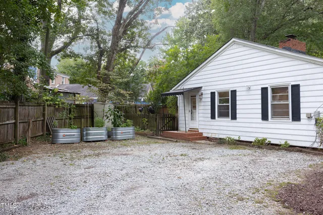 a view of a chairs and table in the patio