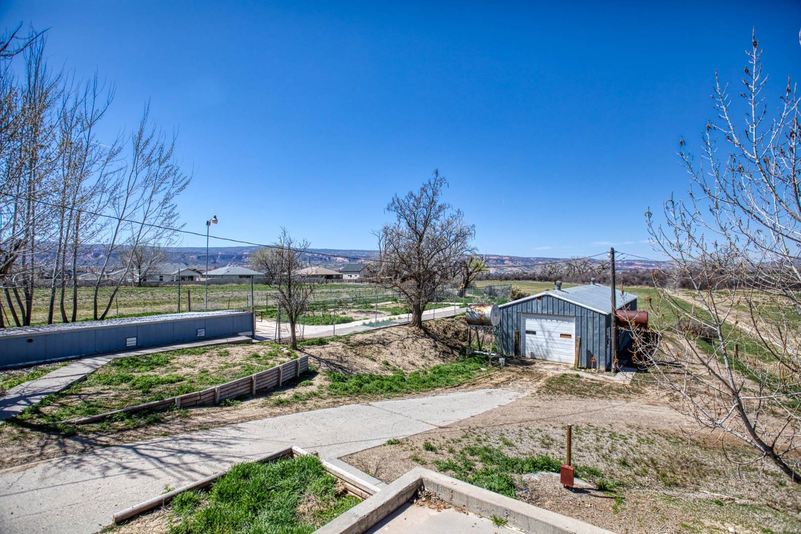 1179 17 Road Fruita, CO 81521 - Photo 2 of 36 a front view of a house with a yard