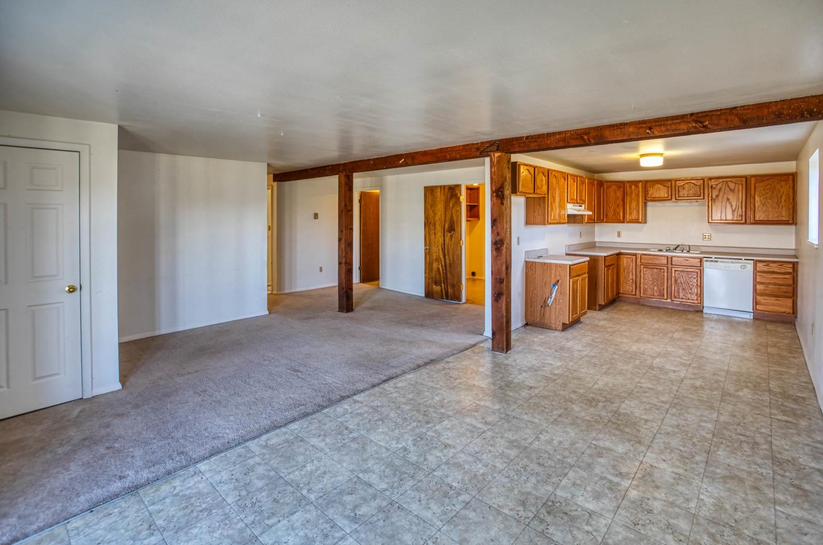 1179 17 Road Fruita, CO 81521 - Photo 3 of 36 a view of an empty room with window and cabinet