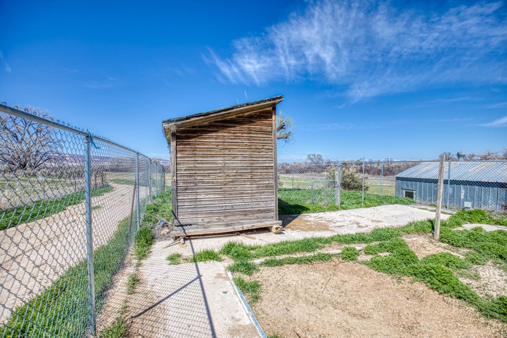 1179 17 Road Fruita, CO 81521 - Photo 32 of 36 a backyard of a house with a wooden fence