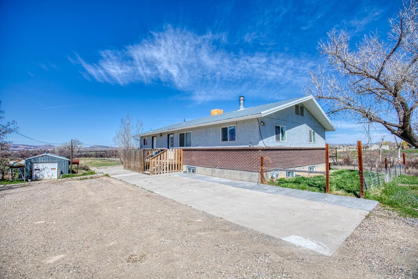 1179 17 Road Fruita, CO 81521 - Photo 5 of 36 a view of a house with a yard