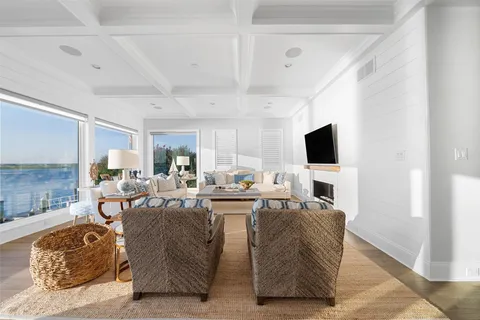 a living room with fireplace furniture and a flat screen tv
