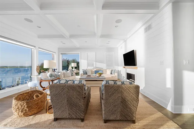 a living room with fireplace furniture and a flat screen tv