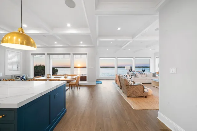 a kitchen with sink and view of living room