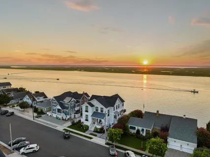 an aerial view of residential building and ocean