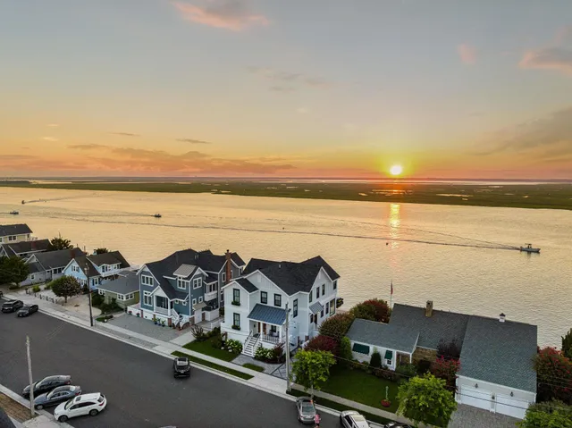 an aerial view of residential building and ocean
