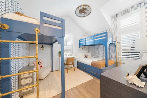 a bedroom with furniture and a window