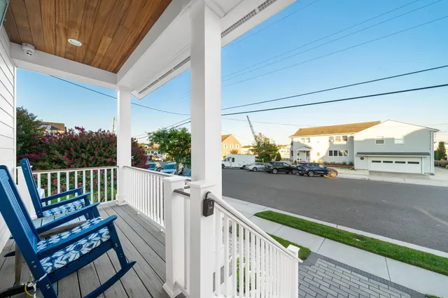 a view of a balcony with wooden floor