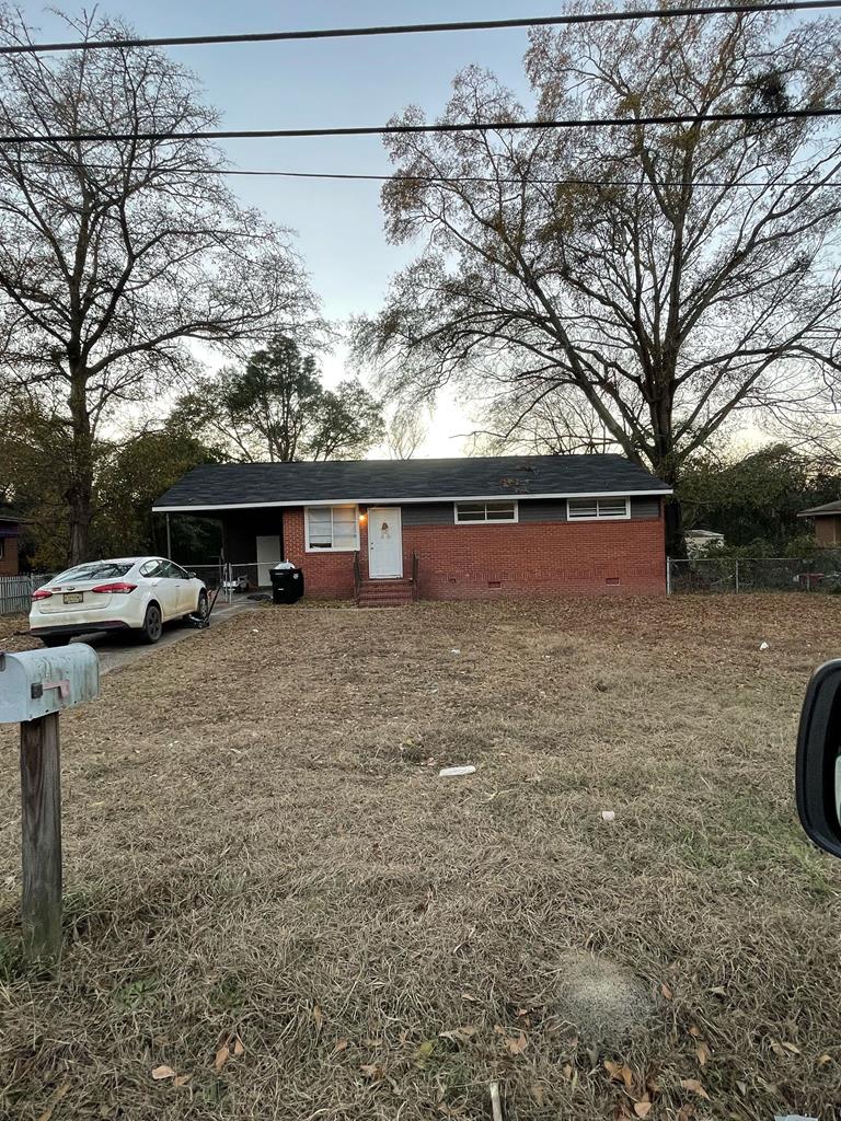 a view of house with car parked