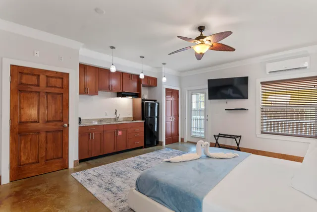 a bedroom with a bed and a lamp on table
