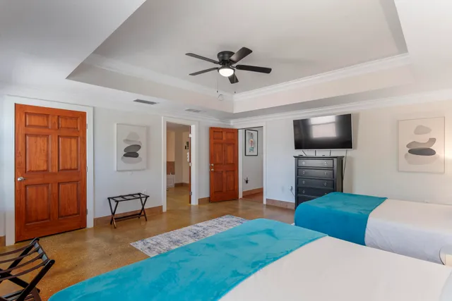 a spacious bathroom with a double vanity sink and a mirror