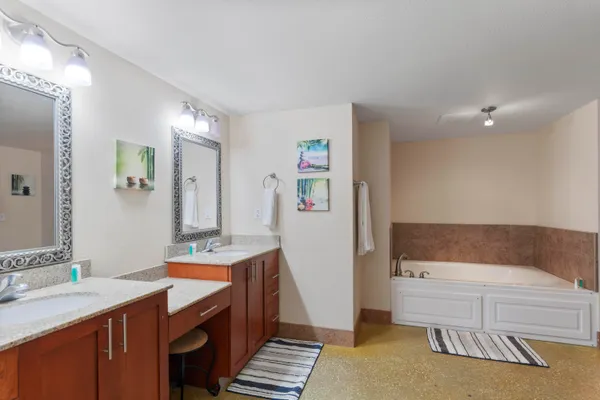 a bathroom with a tub and a shower