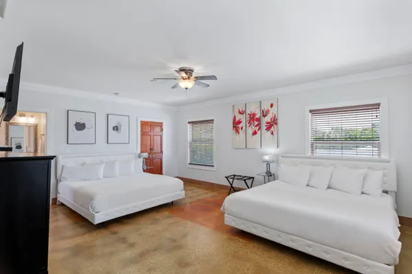 a bedroom with a bed and a flat screen tv