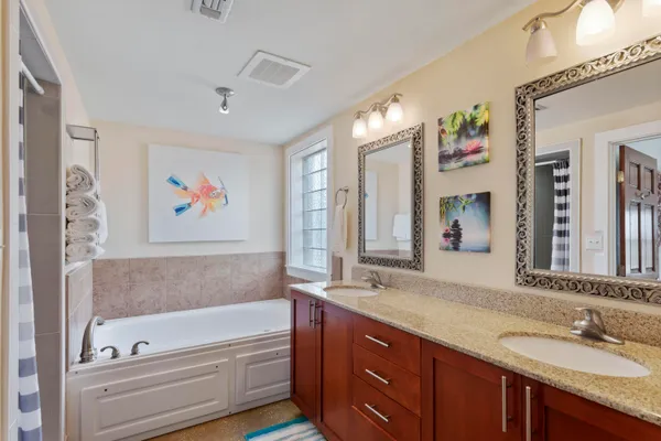 a bathroom with a shower and a sink