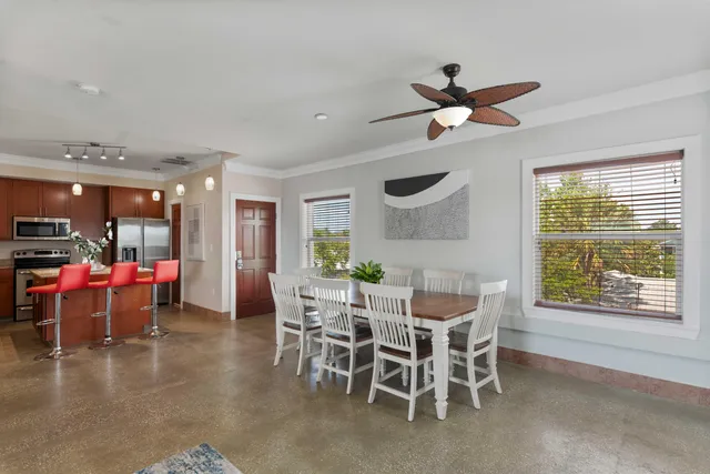 a kitchen with granite countertop a sink cabinets and window