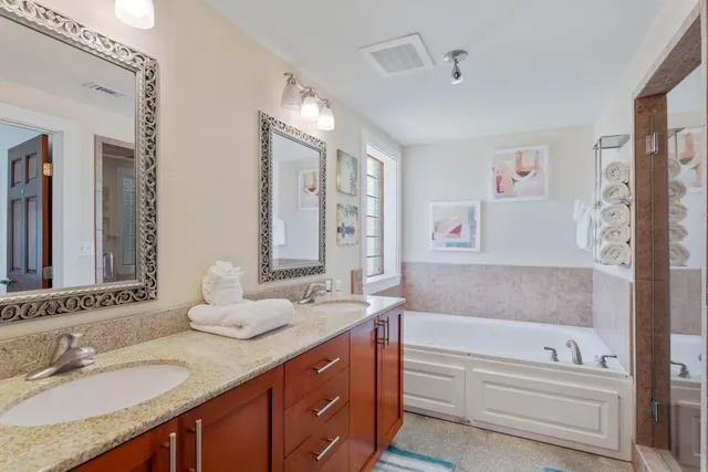 a bedroom with 2 bed and a window