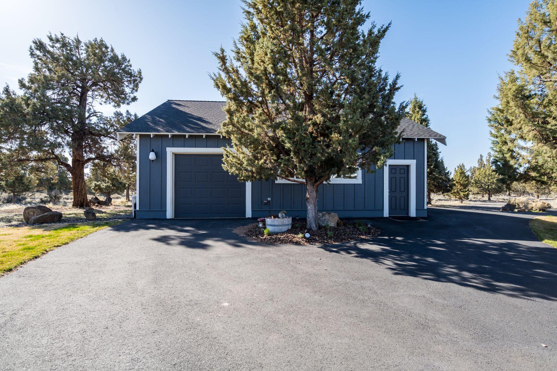 21530 Dale Road Bend, OR 97701 - Photo 39 of 46 a front view of a house with a yard and garage