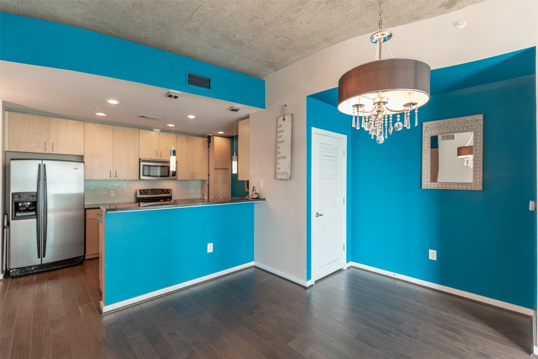 5925 Almeda Road, Unit 11814 Houston, TX 77004 - Photo 12 of 41 Dining and Kitchen area with accent walls and beautiful chandeliers!