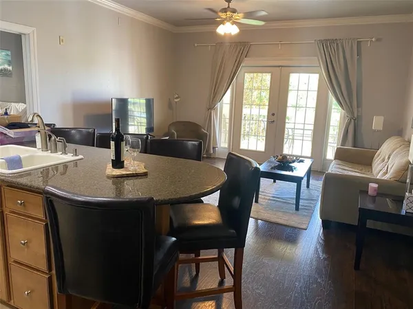 a view of a dining room with furniture and window