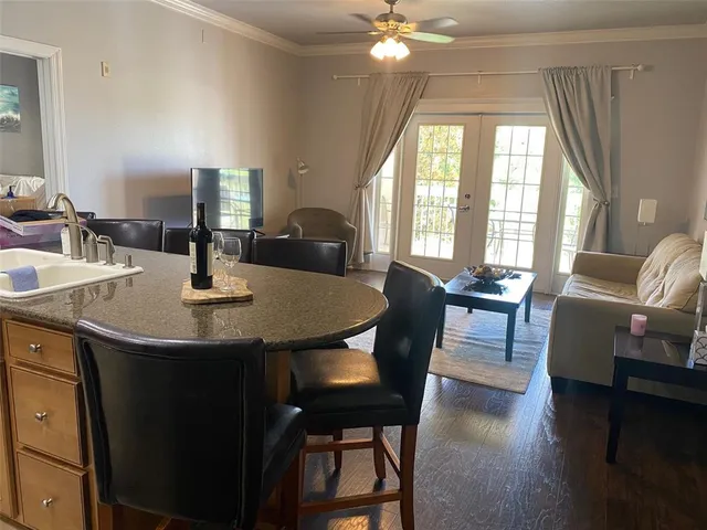 a view of a dining room with furniture and window