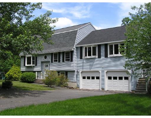 32 Moran Road Billerica, MA 01862 - Photo 1 of 18 a front view of a house with a yard and trees