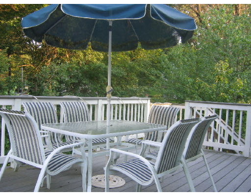 32 Moran Road Billerica, MA 01862 - Photo 6 of 18 swimming view of balcony with furniture and umbrella