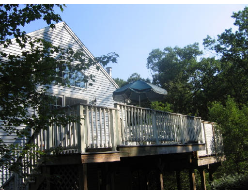 32 Moran Road Billerica, MA 01862 - Photo 7 of 18 a view of balcony with wooden floor and outdoor seating