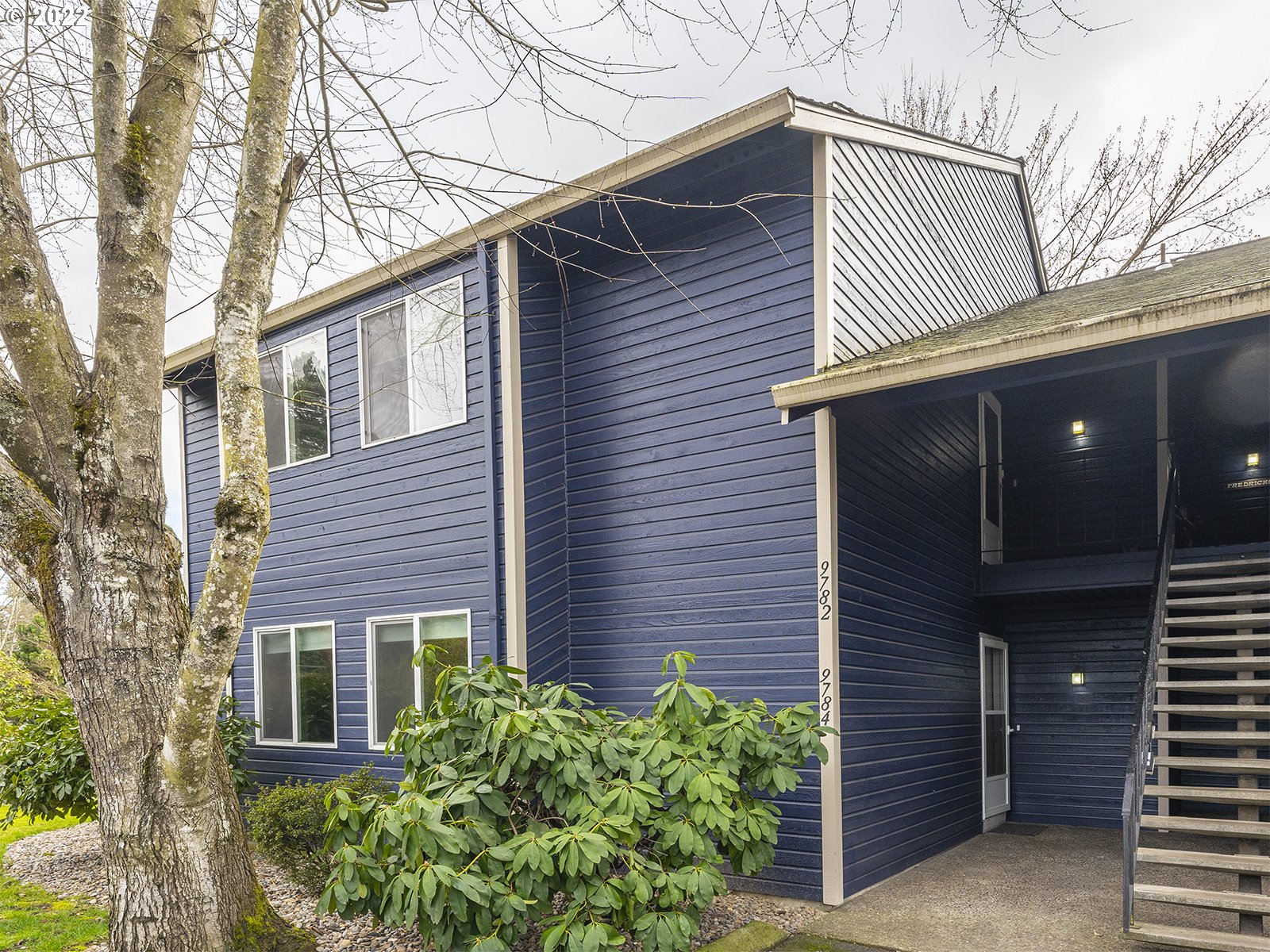 9784 Southwest Tualatin Road Tualatin, OR 97062 - Photo 2 of 32 a view of a house with a yard and potted plants