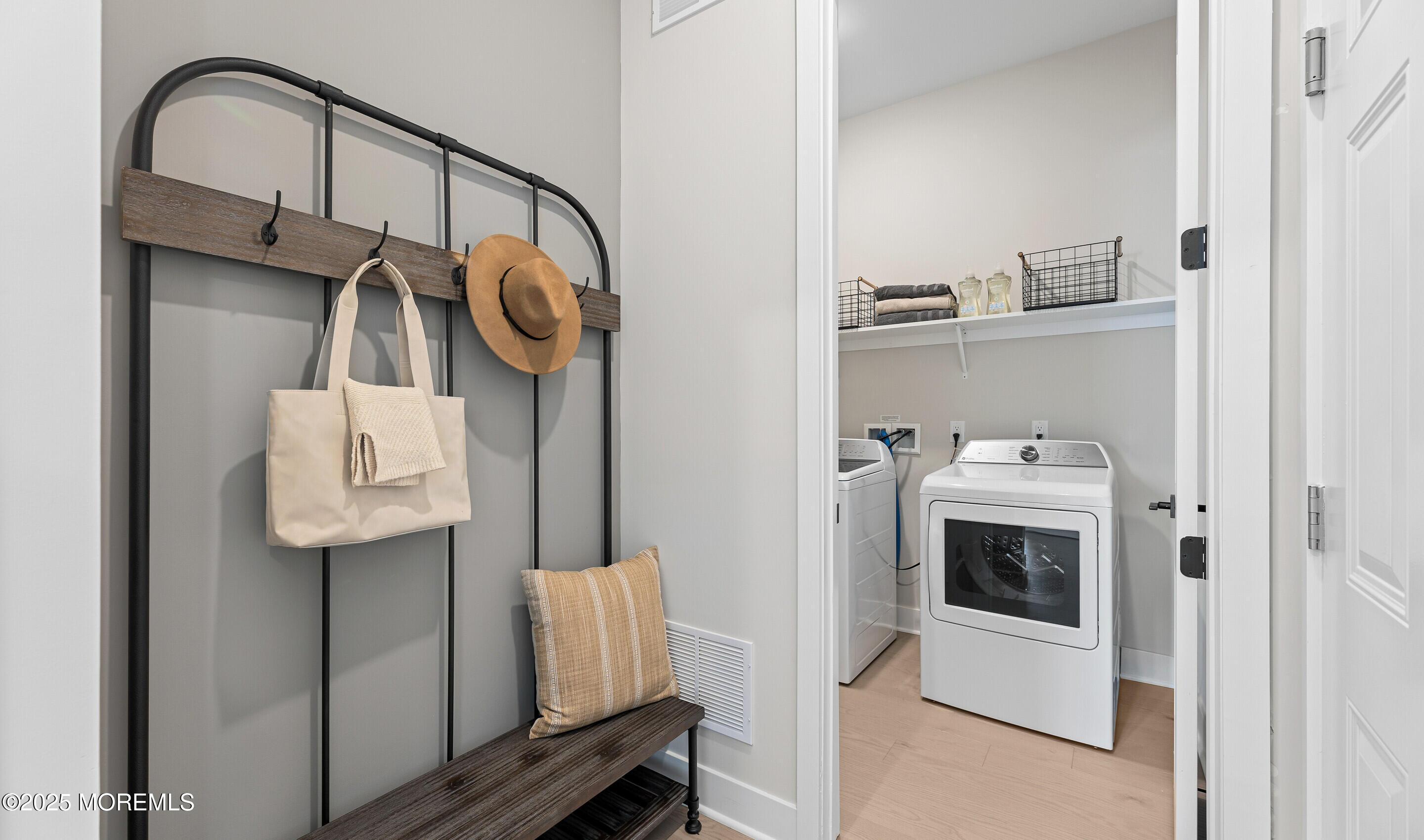 176 Highway 33, Unit DORCHESTER LOFT Manalapan, NJ 07726 - Photo 22 of 38 a utility room with dryer and washer