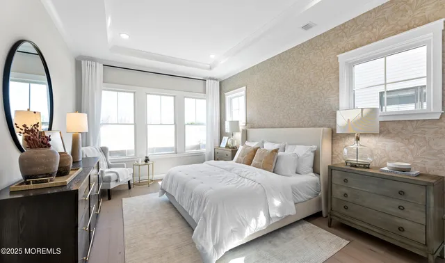 a bed room with a bed and a large window