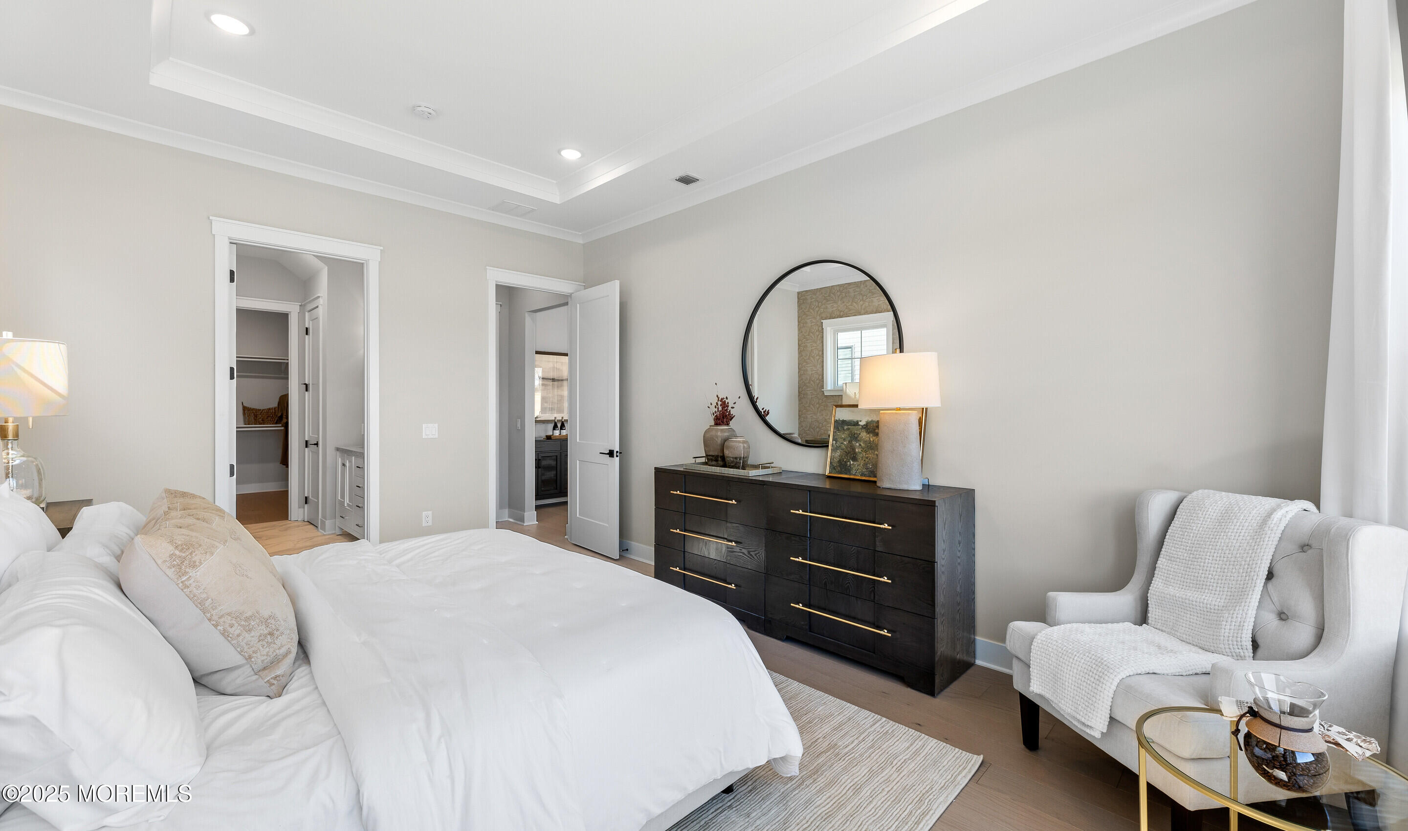 176 Highway 33, Unit DORCHESTER LOFT Manalapan, NJ 07726 - Photo 29 of 38 a bedroom with a bed and a dresser