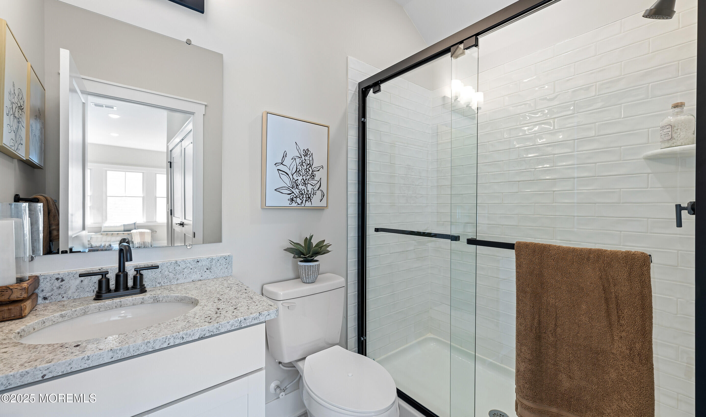 176 Highway 33, Unit DORCHESTER LOFT Manalapan, NJ 07726 - Photo 35 of 38 a bathroom with a granite countertop sink toilet and shower