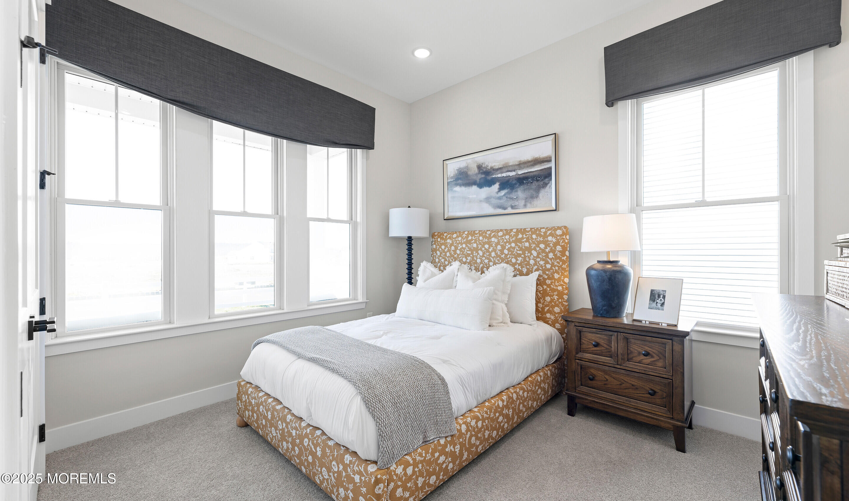 176 Highway 33, Unit DORCHESTER LOFT Manalapan, NJ 07726 - Photo 36 of 38 a bedroom with a bed and windows